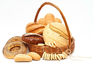 baked breads on wicker round basket